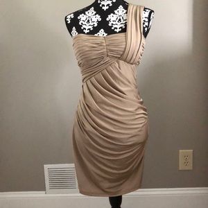 Tan one shoulder cocktail dress.